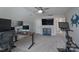 This flex room features a ceiling fan and enough space for a desk and exercise equipment at 8014 Avanti Dr, Marvin, NC 28173