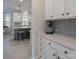 Bright kitchen with white cabinets, light backsplash, and stainless steel appliances in the background at 8014 Avanti Dr, Marvin, NC 28173