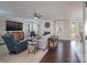 Cozy living room featuring a fireplace, hardwood floors, comfortable seating and plenty of light at 8014 Avanti Dr, Marvin, NC 28173