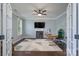 A home office with natural light, modern desk and chair and a neutral patterned rug at 8014 Avanti Dr, Marvin, NC 28173