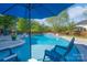 Beautiful pool with lounge chairs and waterfall feature, perfect for summer days and relaxation at 8014 Avanti Dr, Marvin, NC 28173