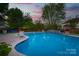 Backyard pool with in-ground pool and mature landscaping at 8014 Avanti Dr, Marvin, NC 28173