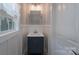 Charming powder room with modern vanity, decorative mirror, and stylish fixtures at 8014 Avanti Dr, Marvin, NC 28173