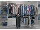 This walk-in closet is very spacious with plenty of built-in shelving and hanging space at 8014 Avanti Dr, Marvin, NC 28173