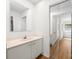 Bathroom featuring a single sink, a framed mirror and a mirrored closet door at 817 Sardis Cove Dr, Charlotte, NC 28270