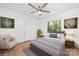 Comfortable bedroom with a plush bed, neutral tones, a ceiling fan and an outdoor view at 817 Sardis Cove Dr, Charlotte, NC 28270