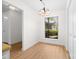 Dining room with wood floors, a chandelier, and natural light from a window overlooking the landscaped yard at 817 Sardis Cove Dr, Charlotte, NC 28270