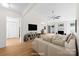 Bright, spacious living room with a decorative fireplace, modern furniture and ample natural light at 817 Sardis Cove Dr, Charlotte, NC 28270