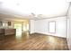 Open living space featuring hard surface floors, bright lighting, and kitchen access at 828 Long Bow Rd, Salisbury, NC 28144