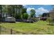 Large backyard featuring a shed and deck, fenced in and nicely manicured at 8705 Carroll St, Hickory, NC 28601