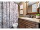 Bathroom with a vanity, decorative mirror and a shower-tub combo at 8705 Carroll St, Hickory, NC 28601