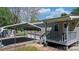 Home exterior with covered parking, small porch and landscaping at 8705 Carroll St, Hickory, NC 28601