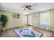 Bright living room featuring wood-look floors, a neutral color palette and a ceiling fan at 8705 Carroll St, Hickory, NC 28601