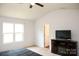 Bedroom features a ceiling fan and ample natural light from the window, creating a bright atmosphere at 8820 First Run Ct, Charlotte, NC 28215
