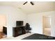 Bedroom with entertainment center, ceiling fan and easy access to bathroom and bedroom at 8820 First Run Ct, Charlotte, NC 28215
