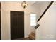 Entryway featuring hardwood floors and stairs along the wall at 8820 First Run Ct, Charlotte, NC 28215