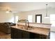 Spacious kitchen with stainless appliances, a breakfast bar, and hardwood-style flooring at 8820 First Run Ct, Charlotte, NC 28215