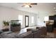 Open-concept living room featuring hardwood floors with lots of natural light and modern finishes at 8820 First Run Ct, Charlotte, NC 28215