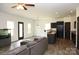 Open-concept living room featuring hardwood floors with lots of natural light and modern finishes at 8820 First Run Ct, Charlotte, NC 28215