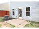 Backyard view with patio, AC unit, siding, door, and small yard with wooden fence at 8820 First Run Ct, Charlotte, NC 28215