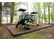 Neighborhood playground with climbing structure, slides and swings at 8820 First Run Ct, Charlotte, NC 28215