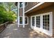 Expansive wooden deck overlooks lush, wooded backyard and mature trees at 9000 Stourbridge Dr, Huntersville, NC 28078