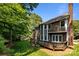 Spacious backyard with large wooden deck and lush green grass at 9000 Stourbridge Dr, Huntersville, NC 28078