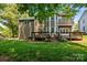 Spacious backyard with large wooden deck and lush green grass at 9000 Stourbridge Dr, Huntersville, NC 28078