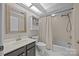 Well-lit bathroom with a shower-tub combination, and neutral toned walls and fixtures at 9000 Stourbridge Dr, Huntersville, NC 28078