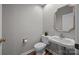 Bathroom with a pedestal sink and a decorative mirror for added charm at 9000 Stourbridge Dr, Huntersville, NC 28078