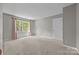 Empty bedroom with carpet, neutral paint, and a window offering natural light at 9000 Stourbridge Dr, Huntersville, NC 28078