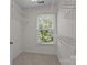 Walk-in closet with shelving, storage, and a window offering natural light at 9000 Stourbridge Dr, Huntersville, NC 28078
