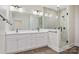 Modern bathroom featuring a double vanity, a glass shower, upgraded fixtures, and neutral finishes at 9165 Cherokee Dr, Hickory, NC 28601