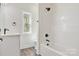 Bathroom with vanity, window and black plumbing fixtures at 9165 Cherokee Dr, Hickory, NC 28601