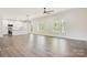 Large living space with hardwood floors, a contemporary chandelier, and many windows offering natural light at 9165 Cherokee Dr, Hickory, NC 28601