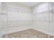 Large walk-in closet with built-in shelving and neutral carpet at 9165 Cherokee Dr, Hickory, NC 28601