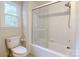 Clean bathroom featuring a shower and bathtub with sliding glass doors at 9439 White Hemlock Ln, Charlotte, NC 28270