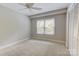 Empty bedroom featuring neutral carpet, a closet, and natural light at 9439 White Hemlock Ln, Charlotte, NC 28270