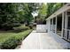 Spacious wooden deck surrounded by lush greenery, offering a serene outdoor space at 9439 White Hemlock Ln, Charlotte, NC 28270