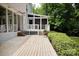Well-maintained wooden deck with steps leading to the yard surrounded by greenery and mature trees at 9439 White Hemlock Ln, Charlotte, NC 28270