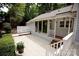 Inviting wooden deck with steps, leading to a beautifully landscaped backyard and garden at 9439 White Hemlock Ln, Charlotte, NC 28270