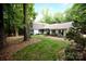 Charming two-story home with a well-manicured lawn and mature trees at 9439 White Hemlock Ln, Charlotte, NC 28270
