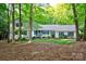 Daytime view of a well-maintained home with lush greenery and a well-kept lawn at 9439 White Hemlock Ln, Charlotte, NC 28270