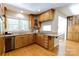 Well-equipped kitchen featuring granite countertops, wood cabinets, and modern appliances at 9439 White Hemlock Ln, Charlotte, NC 28270