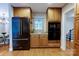 Modern kitchen featuring stainless steel appliances, ample cabinet space, and hardwood floors at 9439 White Hemlock Ln, Charlotte, NC 28270
