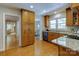Spacious kitchen showcases wood floors, granite counters, and ample cabinet space at 9439 White Hemlock Ln, Charlotte, NC 28270