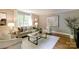 Bright living room featuring neutral tones, hardwood floors, and stylish decor at 9439 White Hemlock Ln, Charlotte, NC 28270