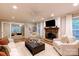 Inviting living room with a fireplace, comfortable seating, and an open floor plan at 9439 White Hemlock Ln, Charlotte, NC 28270