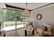 Cozy living room featuring large windows with natural light and backyard views at 9439 White Hemlock Ln, Charlotte, NC 28270