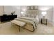 Spacious main bedroom with comfortable bed, bench, and designer decor at 9439 White Hemlock Ln, Charlotte, NC 28270